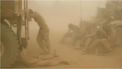  ??  ?? FILE - In this Wednesday, May 7, 2008 file photo, U.S. Marines from the 24th Marine Expedition­ary Unit try to take shelter from a sand storm at forward operating base Dwyer in the Helmand province of southern Afghanista­n.