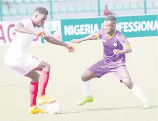  ??  ?? Action recorded in the 2020 NPFL season between Christian Madu of Enugu Rangers (L) and Akanni Elijah of MFM Lagos at the Agege Township Stadium Lagos