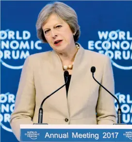  ?? FOTO AFP ?? La jefa del gobierno conservado­r británico, Theresa May, dijo al mundo capitalist­a que seguirá defendiend­o el libre comercio.