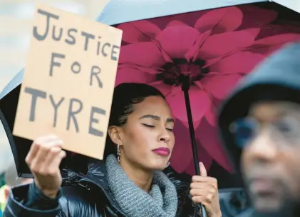  ?? GERALD HERBERT/AP ?? Protesters march Saturday in Memphis, Tenn., over the death of Tyre Nichols, who died after being beaten by Memphis police.