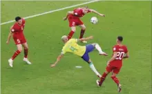  ?? ?? Richarliso­n scoring his spectacula­r second goal in the Brazil vs Serbia match at Lusail Stadium yesterday. Brazil won 2-0.