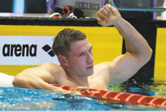  ?? Koji Sasahara / Associated Press ?? Cal alum Ryan Murphy, 23, reacts after winning the men’s 200-meter backstroke final, his second gold medal of the Pan Pacific Championsh­ips in Tokyo.