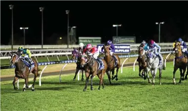  ??  ?? TOP RUN: Red Mako (left) and jockey Emma Ljung hold off the solid-finishing effort of Boiling to win last night’s Benchmark 65 Handicap at Clifford Park..