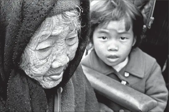  ?? Photograph­s by Don Bartletti ?? HA HOANG — Lisa Ha Nishihara — with her great-grandmothe­r Tran Thi Nam, 109, whom the little girl tagged along after everywhere.