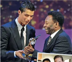  ?? AFP/KEVIN QUIGLEY ?? Passing the baton: Pele with world player of the year Ronaldo in 2009 and Sam Cunningham (right)