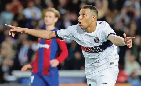 ?? ?? Paris St Germain’s Kylian Mbappe celebrates after scoring against Barcelona