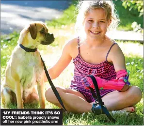  ??  ?? ‘MY FRIENDS THINK IT’S SO COOL’: Isabella proudly shows off her new pink prosthetic arm