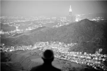  ?? — Reuters photo ?? File photo shows a Muslim pilgrim prays atop Mount Thor in the holy city of Mecca ahead of the annual haj pilgrimage.