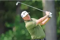  ?? CARLOS OSORIO — STAFF, AP ?? Taylor Pendrith drives off the 11th tee Friday at the Rocket Mortgage Classic in Detroit.