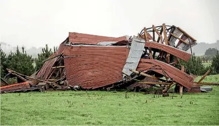  ?? ANDY JACKSON/FAIRFAX NZ ?? This hay shed on Rama Rd, south of Opunake, was picked up and dumped in the paddock by the fierce winds that tore through the region in the early hours of yesterday. However, Met Service says it wasn’t a tornado.