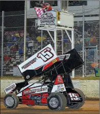  ?? Special to the Democrat-Gazette/JIMMY JONES ?? Sam Hafertepe Jr. of Sunnyvale, Texas, takes the checkered flag to win the ASCS national tour race May 12 at I-30 Speedway in Little Rock. Hafertepe and the rest of the other drivers at this weekend’s 31st annual Comp Cams Short Track Nationals will be trying to find a way to beat five-time winner Sammy Swindell.