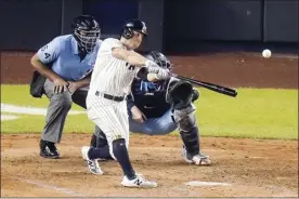  ?? AP photo ?? The Yankees’ Brett Gardner hits a two-run homer in the fourth inning of New York’s 10-7 win over the Toronto Blue Jays on Thursday.