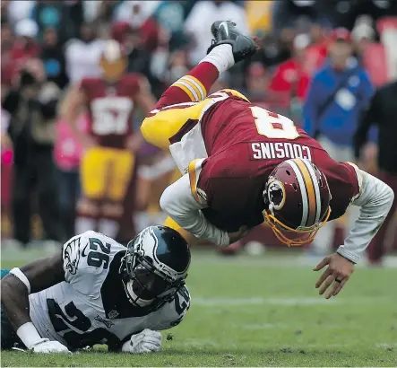  ?? ROB CARR/ GETTY IMAGES ?? Kirk Cousins, right, of Washington shook off a tendency to throw intercepti­ons in leading his team over Philadelph­ia Sunday.