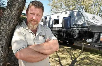  ?? Photo: Bev Lacey ?? AWARD: Jason Emeny at his Harristown home with the family’s caravan which he was towing when an elderly couple crashed on a remote road in front of them.