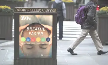  ??  ?? A sign for Tishman Speyer Properties’ Zo programme outside Rockefelle­r Center in New York on Feb 26. — WP-Bloomberg photos