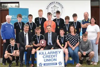  ??  ?? Killarney Credit Union Financial Controller Stephen Darmody (front fourth from left) presenting the winning medals and trophy to JR Spares team Jack Leader, Dylan Roche, Evan Lucey, Ian Roche, Eoghan Kelly, Michael Dennehy, Michael McSweeney, Jack...