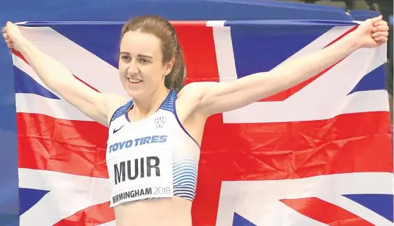  ?? Picture: PA. ?? Laura Muir celebrates silver in the World Indoor Championsh­ips 1,500m to add to the bronze she won earlier in the 3,000m.