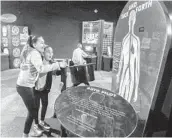  ?? EDUARDO CONTRERAS U-T ?? Sisters Priscilla (right) and Kayla Villasenor enjoy one of the new brain displays at the Fleet center.