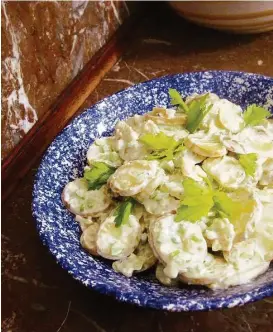  ?? Sara Moulton / Associated Press ?? Creamy Buffalo Potato Salad uses both baking potatoes, which are higher in starch and fluffier in texture, and boiling potatoes, which hold their shape when cooked.