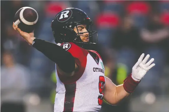  ?? SEAN KILPATRICK/THE CANADIAN PRESS ?? Redblacks quarterbac­k Nick Arbuckle throws a pass against the Montreal Alouettes during Friday's pre-season game. He completed 15-of-25 passes.