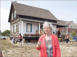  ?? Canadian Press photo ?? Annette Dionne, one of the two surviving Dionne quintuplet­s, visits the original cabin she was born in, relocated to downtown North Bay next to the North Bay Museum on Sunday.