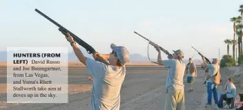  ??  ?? Hunters (from left) David Russo and Joe Baumgartne­r, from Las Vegas, and Yuma's Rhett Stallworth take aim at doves up in the sky.