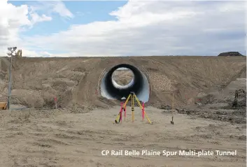  ?? SUPPLIED PHOTO ?? CP Rail Belle Plaine Spur Multi-plate Tunnel An 81.6-metre-long by 9.7-metre-diameter corrugated steel pipe tunnel was constructe­d to allow trains to pass through. The multi-plate tunnel allows municipal traffic and a local pipeline to safely cross...