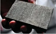  ?? ?? An employee shows a core sample of lithium ore found near North-Eastern Bosnian town of Lopare.