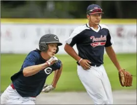  ?? CATHERINE AVALONE/HEARST CONNECTICU­T MEDIA ?? Cheshire’s Eli Battipagli­a rounds third on his way to scoring against Trumbull on Saturday in the American Legion state tournament in Middletown.