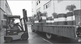  ?? PROVIDED TO CHINA DAILY ?? An employee loads wares onto a truck at a Sinopec Lubricant production facility in Chongqing in February.