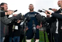  ?? PHOTOSPORT ?? Kieran Read is besieged by media after the All Blacks completed their captain’s run at Eden Park yesterday.