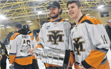  ?? TINA COMEAU/SALTWIRE NETWORK ?? Yarmouth Mariners goalie Tyler Caseley, left, and teammate Landon Quinney with the Maritime Junior Hockey League’s Canadian Tire Cup during a victory rally Saturday at the Yarmouth Mariners Centre in southwest Nova Scotia.