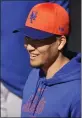  ?? JEFF ROBERSON — AP ?? New York Mets pitcher Kodai Senga smiles during a spring training workout on Tuesday in Port St. Lucie, Fla.