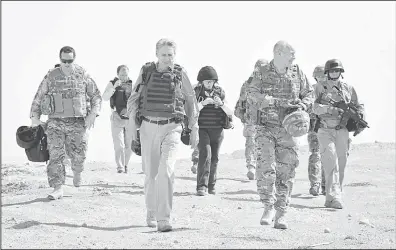  ??  ?? This handout picture received on May 11, from Britain’s Ministry of Defence shows Phillip Hammond (third left), Secretary of State for Defence being given a tour during his visit to Observatio­n Post Sterga 2 in Afghanista­n’s Helmand Province on May 7....