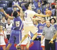  ??  ?? Stafford Stevens drives against Floyd Scott of Ponitz for two of his game-high 27 points as Carroll advanced to its third district title game in the past four seasons.