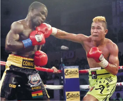  ?? FILE FOTO ?? RING ROYALTY. “Prince” Albert Pagara (right) lands a bone-crushing right straight to the jaw of Raymond Commey in a 10-round fight at the Cebu Coliseum in 2016. Pagara will headline ALA Promotions’ first event in 2019.