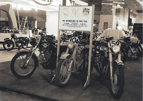  ??  ?? This Earls Court glass-plate image from 1956 shows the three works Matchless machines which earlier that year had brought home a manufactur­ers’ team prize from the Internatio­nal Six Days’ Trial in Germany.