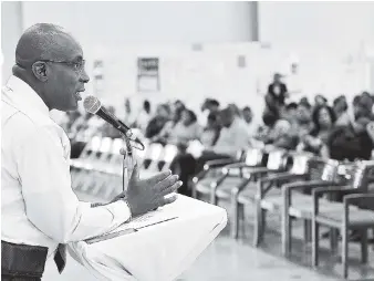  ?? ANGUIN/PHOTOGRAPH­ER ?? Minister of Education Ruel Reid addresses teachers and principals during a teacher sensitisat­ion and consultati­on session at the Old Harbour New Testament Church in St Catherine on October 2. Government’s so-called exemption of civil servants from paying auxiliary fees proves the State’s policy on the presumably voluntary charges is confusing and dissonant.