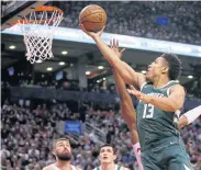  ?? USA TODAY SPORTS ?? The Bucks’ Malcolm Brogdon scores against the Raptors in Toronto.