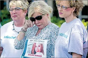  ?? Arkansas Democrat-Gazette/BENJAMIN KRAIN ?? Laurie Jernigan (center), mother of missing teen Ebby Steppach, wipes tears while announcing a $50,000 reward for informatio­n about her daughter’s disappeara­nce during a news conference at the Little Rock Police Department on Tuesday. With her are...
