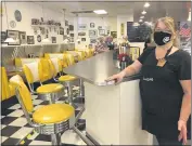  ?? ADAM BEAM — THE ASSOCIATED PRESS ?? Restaurant manager Lori Pack stands at the counter of Linda’s Soda Bar and Grill in Yuba City on Thursday. Pack says the restaurant tried takeout-only service for three weeks earlier this year during the coronaviru­s pandemic. But she said it was “just not sustainabl­e.”