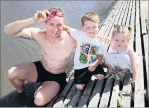  ??  ?? DIPPING A TOE: Horsham’s Sam Anson, pictured with his children Jaijai, 5, and Tigerlily, 2, will take on a 50-kilometre swim challenge in the Wimmera River tomorrow. Picture: PAUL CARRACHER