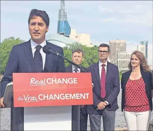  ?? CP PHOTO ?? Liberal Leader Justin Trudeau, alongside Manitoba Liberal candidates, talks to reporters in Winnipeg, Thursday.
