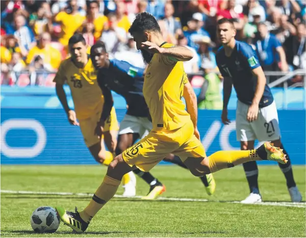  ?? Picture: AFP/FRANCK FIFE ?? Australia's Mile Jedinak takes a penalty kick to level the scores in last night’s World Cup pool match against France at the Kazan Arena