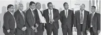  ??  ?? Chief Operating Officer Epic Lanka Technologi­es Thareendra Kalpage receiving the award together with the Epic team at NBQSA 2017