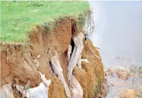  ??  ?? The recent floods affected the cemetery in Kohilawatt­a, Wellampiti­ya with coffins being exposed and some of the bodies being washed away. The cemetery was affected by the major floods last year too. Pic by Lal S. Kumara