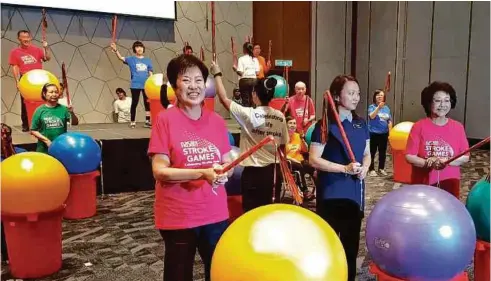  ??  ?? (From left) Yeo, Women, Family and Community Developmen­t Deputy Minister Hannah Yeoh and Nasam patron Toh Puan Dr Aishah Ong at the launch of the Stroke Games.