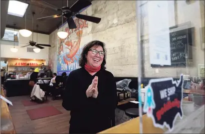  ?? Associated Press photos ?? Chef Proprieter Brenda Buenviaje smiles as she is interviewe­d at Brenda’s French Soul Food in San Francisco on Dec. 9. In pre-pandemic days, Brenda’s French Soul Food was always hopping, but everything came to a screeching halt on March 16, when San Francisco halted indoor dining to stop the spread of the coronaviru­s. It reopened for takeout and delivery, and Buenviaje is now shipping meals nationwide through a service called Goldbelly.