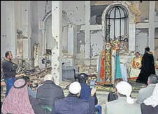  ??  ?? Syriac Orthodox Patriarch of Antioch, Ignatius Aphrem II, gives a sermon during mass at the heavily damaged Syriac Orthodox church of St. Mary in Syria's Deir Ezzor city on Saturday.