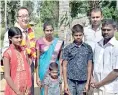  ??  ?? Tung-lai Margue meeting a beneficiar­y family